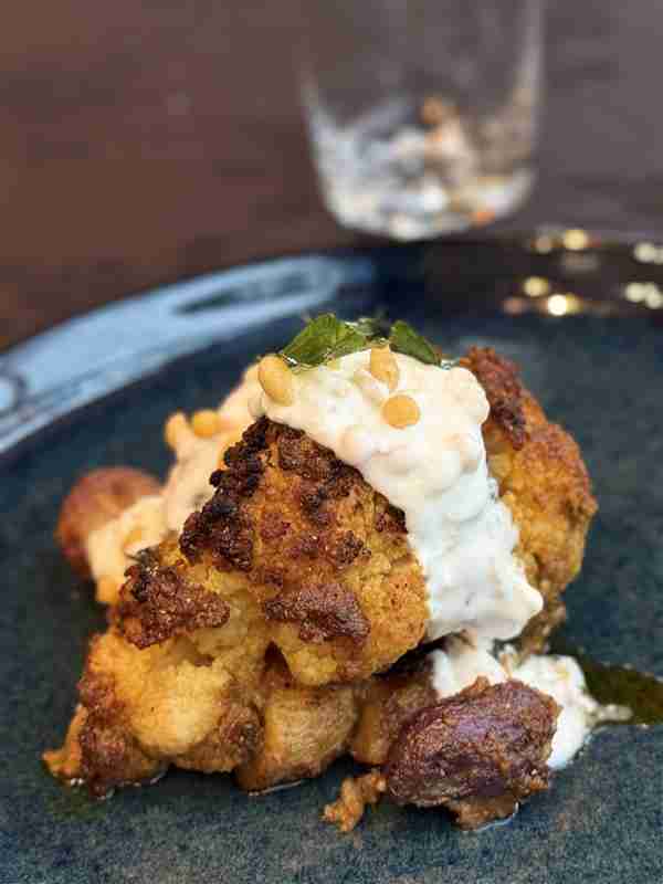 The name "Ohui" means "Place of Meeting" in te reo Māori, and it perfectly captures the restaurant's philosophy. Located in Birkdale, this spot has over four decades of hospitality history. Chef Dinesh and co-founder Diana Kapadia have transformed it into a hub for cultural exchange on the plate, blending Dinesh’s Chennai roots with New Zealand produce and flair.