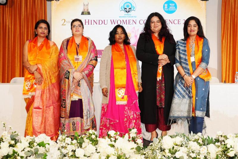 Sarisha with panel members at the conference